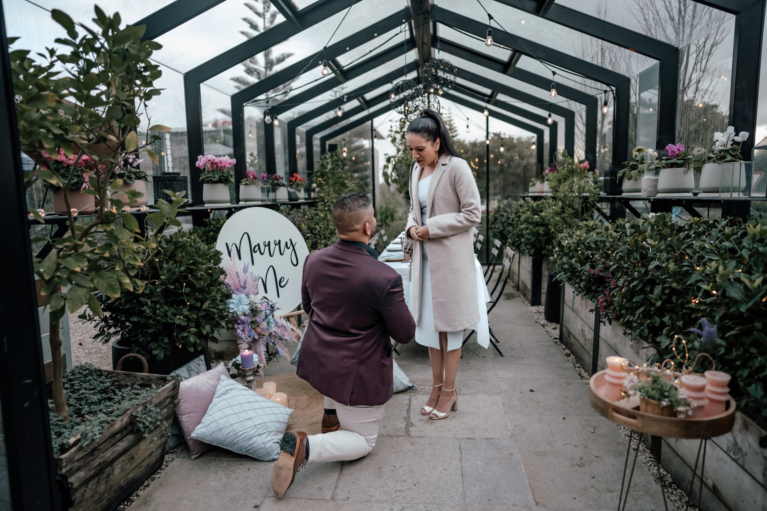 Elegant proposal at The Grange in Takapuna with soft pastel decor, long-table setup, and surprise family celebration, captured by Auckland proposal photographer Zanthe Vorsatz