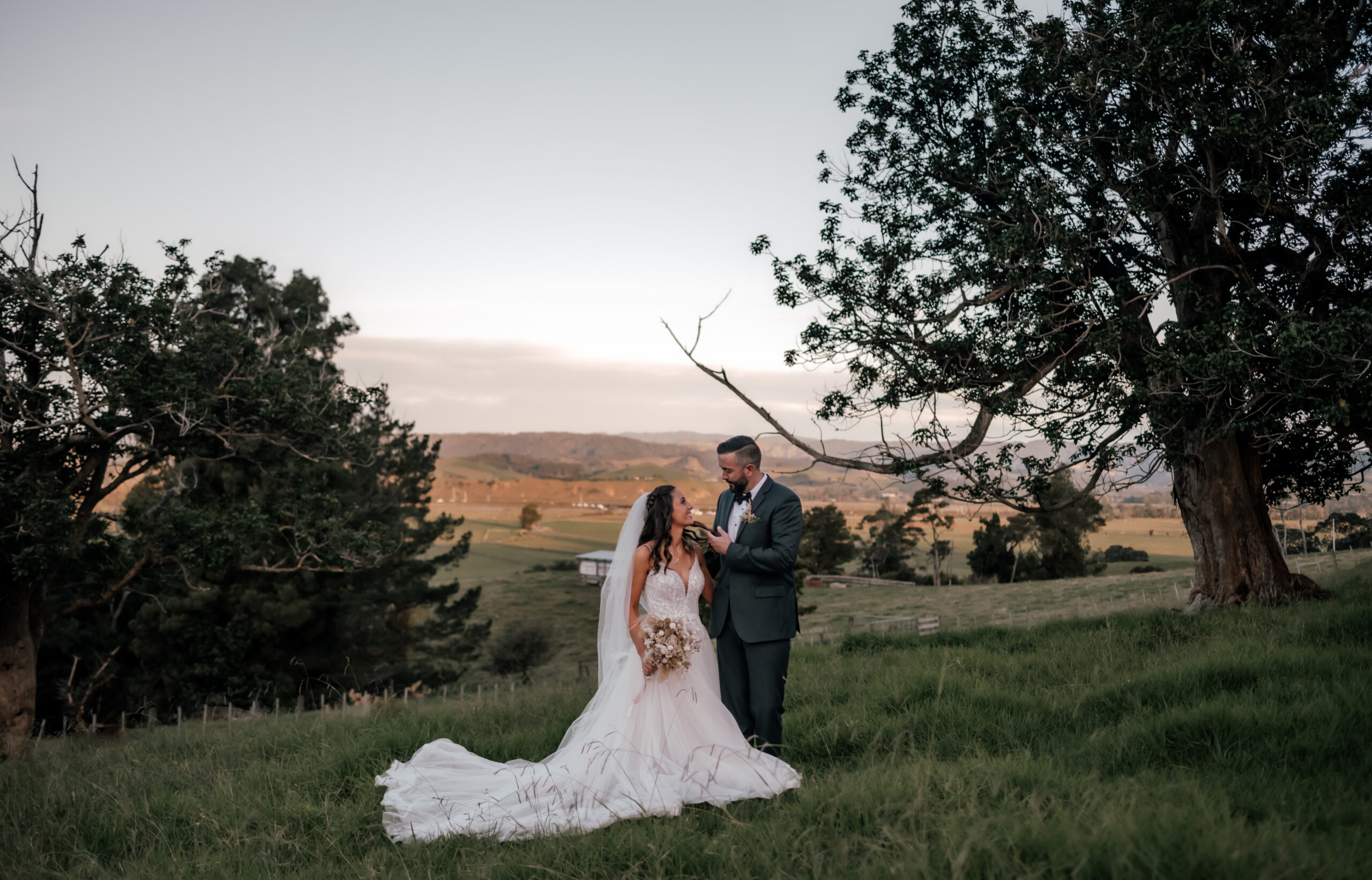 Rustic wedding ceremony at Nocton Woolshed with outdoor vows, wooden arch, and scenic countryside portraits of bride and groom, Nadia and James.