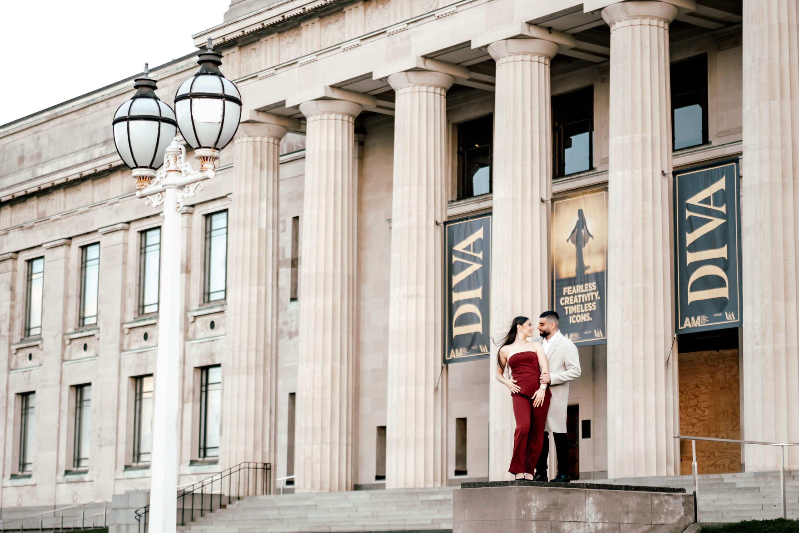 Surprise proposal at Auckland Domain with Fernand down on one knee and Nohadra joyfully reacting