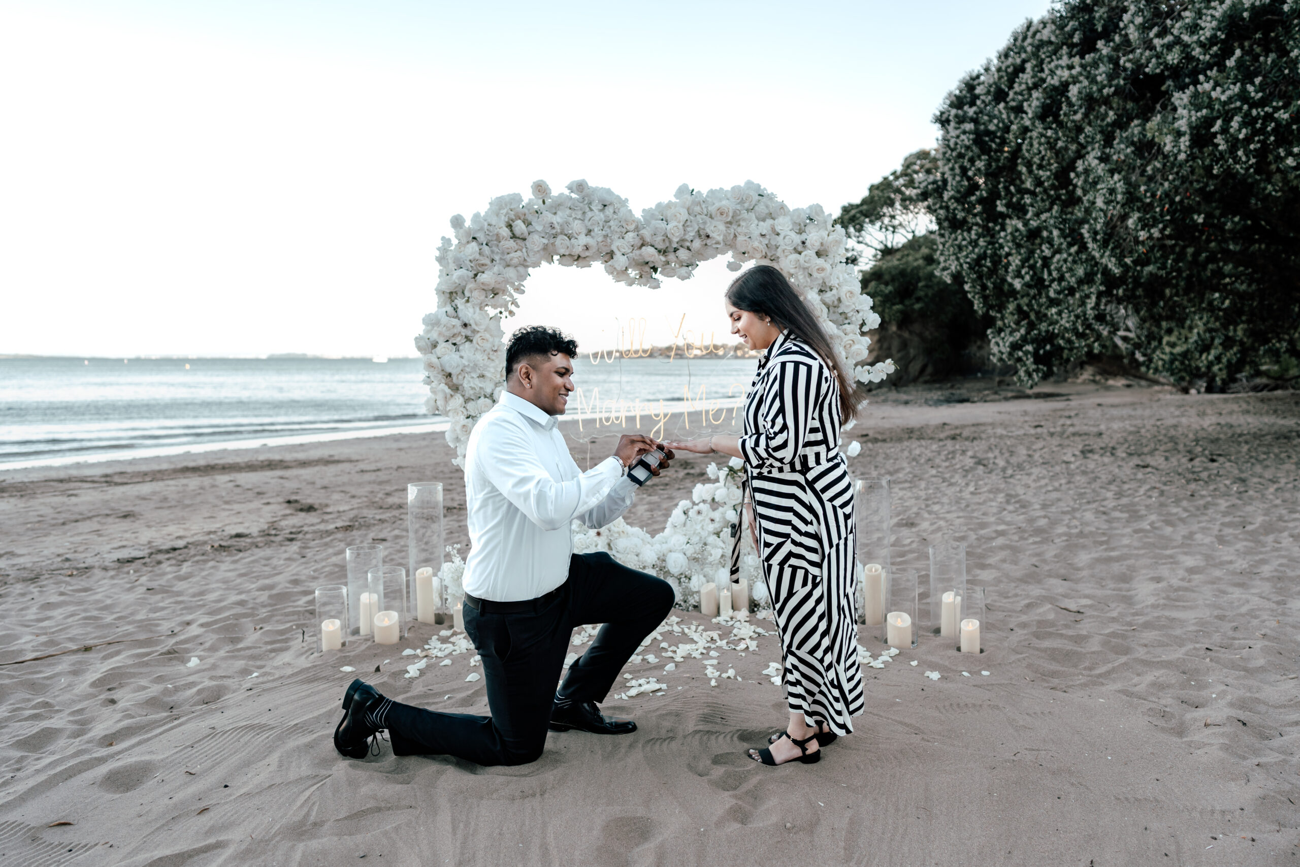 Romantic proposal setup at Castor Bay Beach with Luxury Lane captured by Zanthe Vorsatz Photography