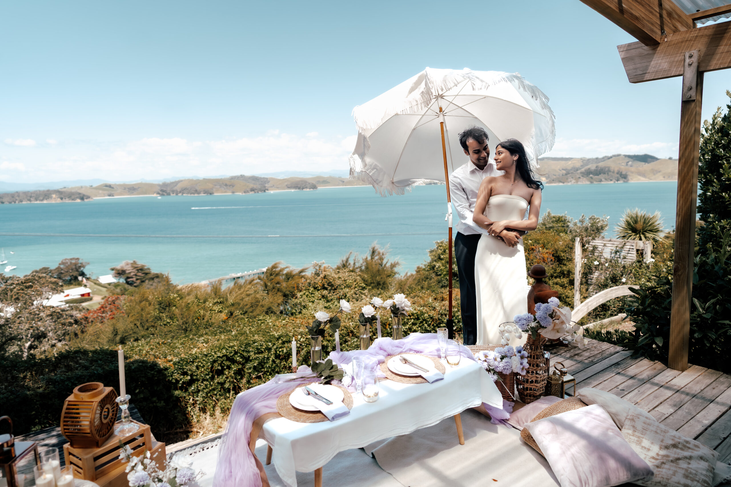 Waiheke Island proposal setup with ocean and blue sky views