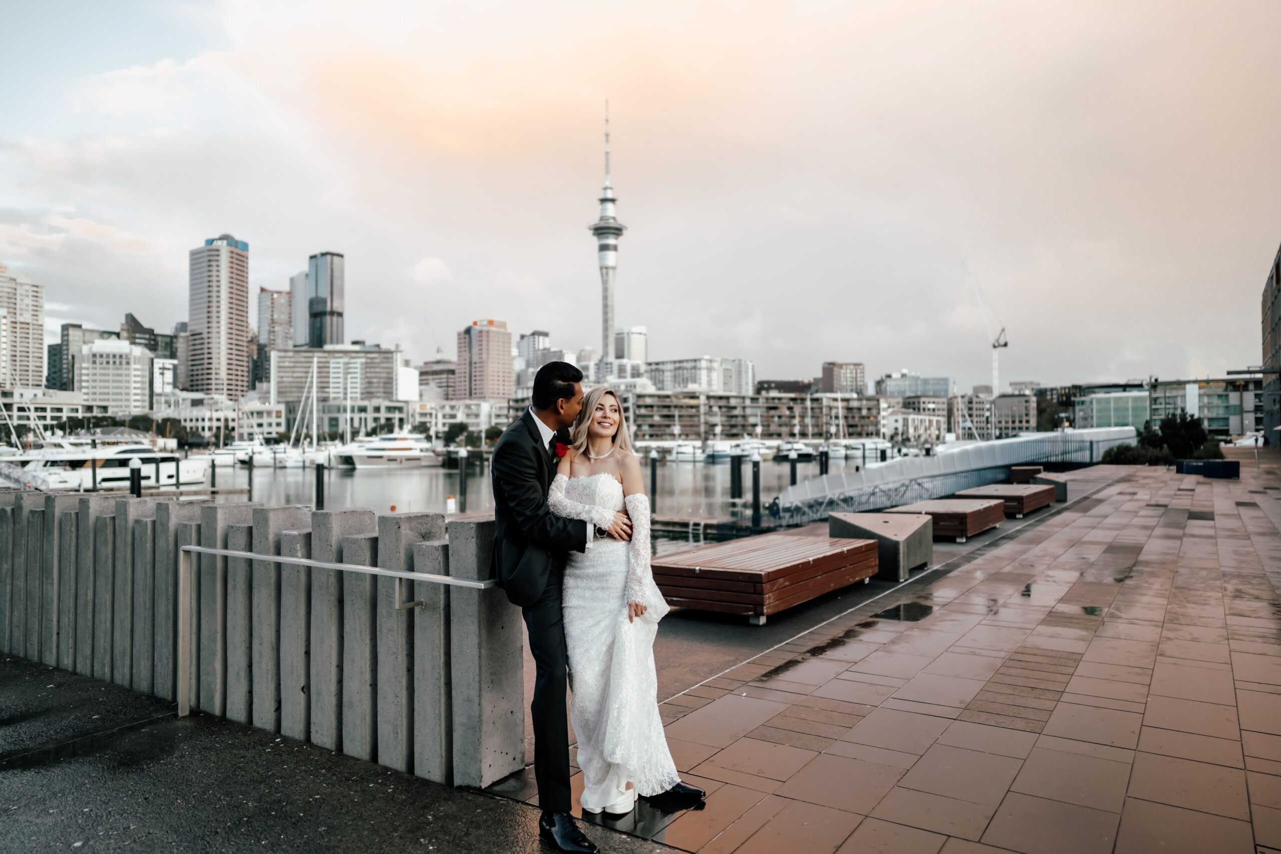 Ruwan and Anabel celebrating their intimate wedding at Park Hyatt Auckland overlooking the waterfront.